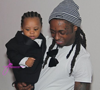 Lil Wayne taking a picture with his son Neal.